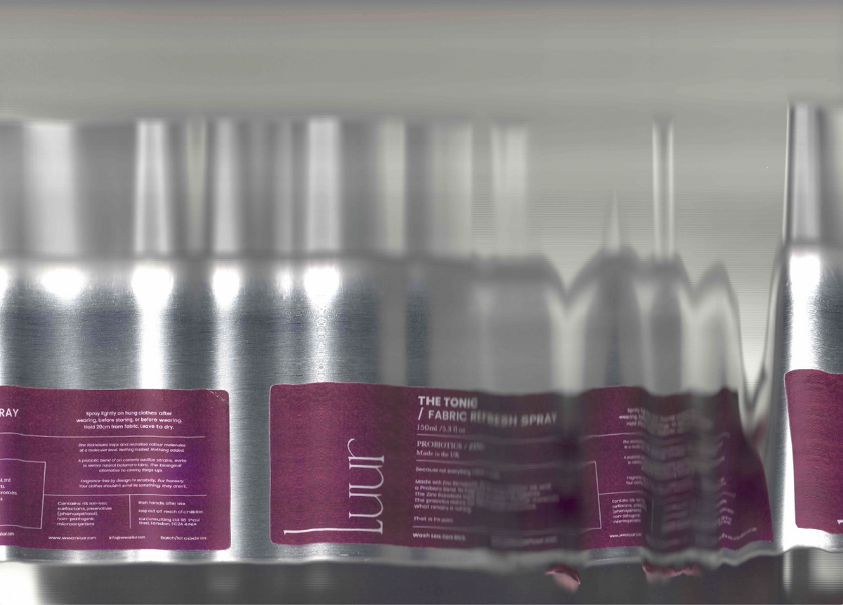 A close-up of several metallic silver cosmetic tubes stacked vertically, each with a deep purple label. The brand name 'Luur' is clearly visible on the labels.